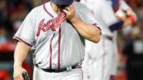 Bartolo Colon trudges off the field during a nine-run third inning Tuesday, when the Braves made three errors and other defensive mistakes and added seven unearned runs allowed to their majors-leading total. (AP photo)