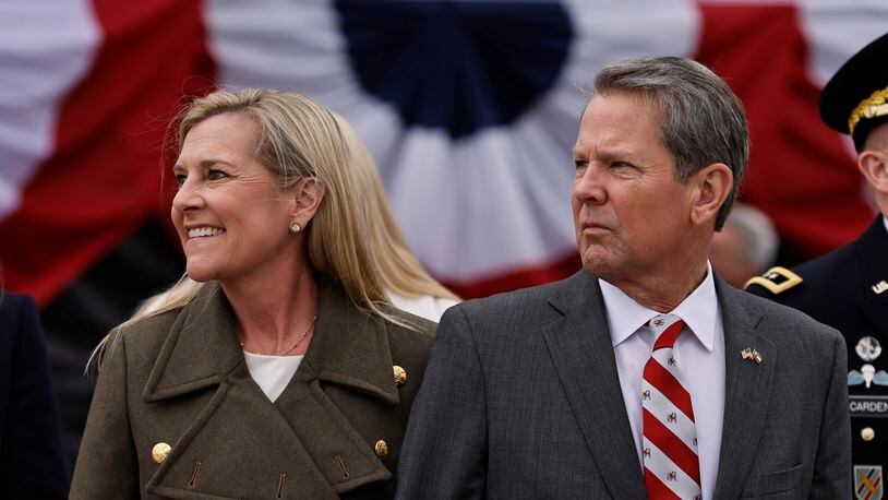Gov. Brian Kemp, shown at his inauguration Thursday with his wife, Marty, is entering his second term with a shift in approach. “I can be a little frank now in my second term.” he told supporters. (Natrice Miller/natrice.miller@ajc.com)