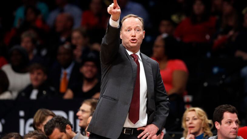 Atlanta Hawks coach Mike Budenholzer gestures to his team during the second quarter of an NBA basketball game against the Brooklyn Nets on Wednesday, April 8, 2015, in New York. (AP Photo/Jason DeCrow)