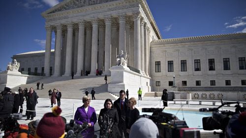 Stephanie Toti, senior counsel at the Center for Reproductive Rights, center, speaks to members of the media outside the U.S. Supreme Court with Amy Hagstrom Miller, founder and chief executive officer of Whole Woman's Health, left, and Nancy Northup, president and chief executive officer of the Center for Reproductive Rights, right, in Washington, on March 2, 2016. In a presidential campaign unlike any other, the U.S. Supreme Court has been treated almost as an afterthought, but that will change on Wednesday night.Debate moderator Chris Wallace of Fox News is making the high court one of six topics for the final debate between Donald Trump and Hillary Clinton, and the timing couldn't be better.
