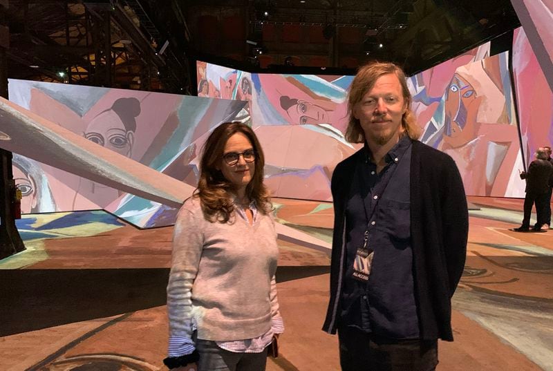 Annabelle Mauger, exhibition director, and Jacob Cohl, vice president of experiential/exhibitions for S2BN Entertainment, organized the Picasso immersive exhibit at Pullman Yards. This shot was taken at the exhibit on March 16, 2022. RODNEY HO/rho@ajc.com