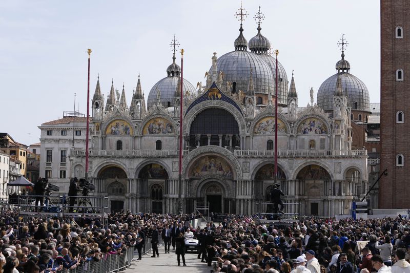 Pope Francis arrives in St. Mark Square to celebrate a mass in Venice, Italy, Sunday, April 28, 2024. The Pontiff arrived for his first-ever visit to the lagoon town including the Vatican pavilion at the 60th Biennal of Arts. (AP Photo/Alessandra Tarantino)