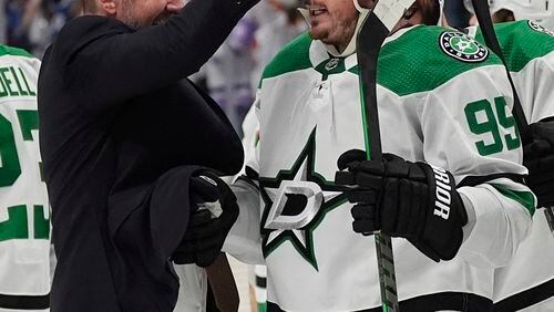 Dallas Stars head coach Peter De Boer, left, congratulates center Matt Duchene after he scored the winning goal in the second overtime of Game 6 of an NHL hockey playoff series against the Colorado Avalanche Friday, May 17, 2024, in Denver. (AP Photo/David Zalubowski)