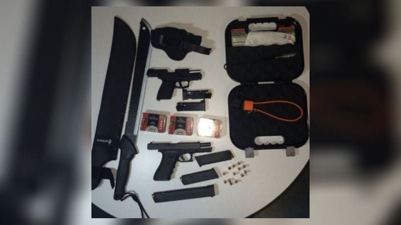 Inside Hall's car, police found two unloaded 9mm handguns and 138 rounds of ammunition, along with a machete and a hatchet. (Credit: New York Post)