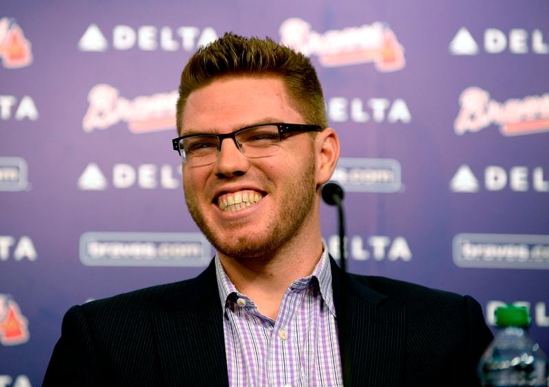 Atlanta Braves first baseman Freddie Freeman smilies as he announces that he has agreed to terms with the team that will keep him in a Braves uniform for eight years, on Wednesday, Feb. 5, 2014, in Atlanta. Braves General manager Frank Wren said, "Freddie has established himself as one of the best young talents in the game." David Tulis / AJC Special Atlanta Braves first baseman Freddie Freeman smilies as he announces that he has agreed to terms with the team that will keep him in a Braves uniform for eight years, on Wednesday, Feb. 5, 2014, in Atlanta. Braves General manager Frank Wren said, "Freddie has established himself as one of the best young talents in the game." David Tulis / AJC Special