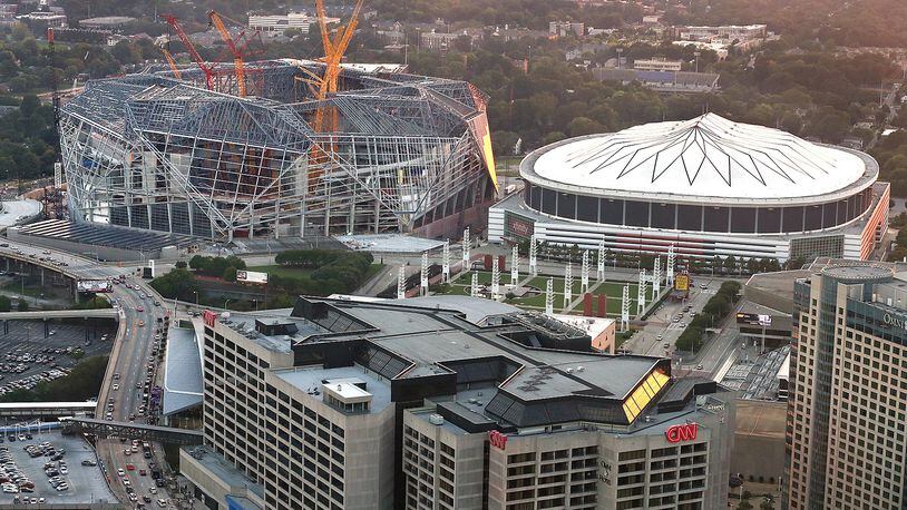 082516 ATLANTA: Mercedes-Benz Stadium, the new home of the Atlanta Falcons, continues to take shape beside the Georgia Dome as seen on Thursday, August 25, 2016, in Atlanta. Curtis Compton /ccompton@ajc.com