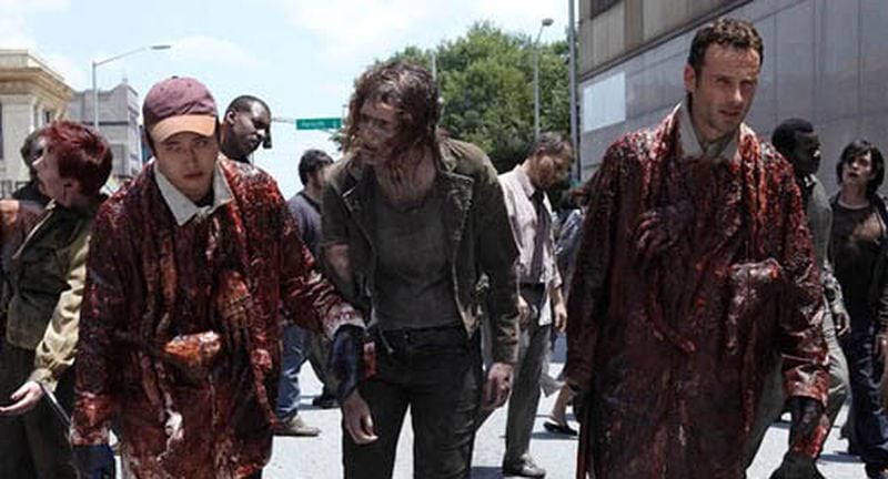 The season one episode where Glenn and Rick wear guts to get by some walkers. It worked - until it rained. Look how young they were in 2010! CREDIT: AMC