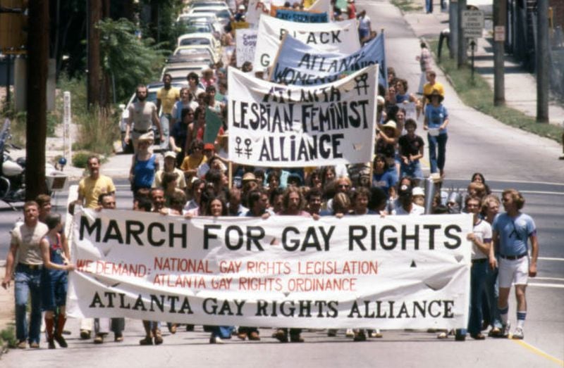 Atlanta Gay Rights Alliance and others leading the Pride parade through Atlanta, June 25, 1977. About 1,200 marchers began downtown and marched up to Piedmont Park. (Jerome McClendon / AJC Archive at GSU Library AJCN015-026a)