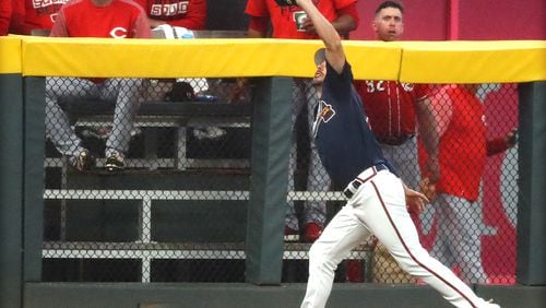 March 25, 2019 Atlanta: Atlanta Braves outfielder Matt Joyce runs down a fly ball at the fence by Cincinnati Reds Jesse Winkler during the first inning in a MLB preseason baseball game on Monday, March 25, 2019, in Atlanta.    Curtis Compton/ccompton@ajc.com