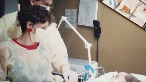 Andy and Susan May in March of 1991 after their son, Nick, who was not yet 2, received a heart transplant. (Photo courtesy of Susan May)