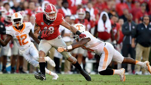 Georgia Bulldogs tight end Isaac Nauta finishes off a first-down pass reception against Tennessee last October.