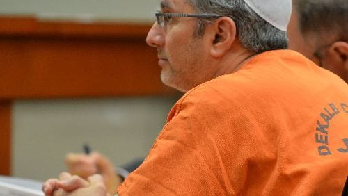 Hemy Neuman, convicted to life in prison for the 2010 murder of Rusty Sneiderman, is seeking a new trial. He is shown during a March 2014 court appearance.