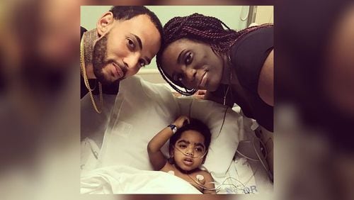 Two-year-old A.J. Burgess with his parents, Carmellia Burgess and Anthony Dickerson. A.J. was born without kidneys. His father is a perfect match and willing donor, but hospital protocol pushed back the surgery after Dickerson violated probation. (Handout)
