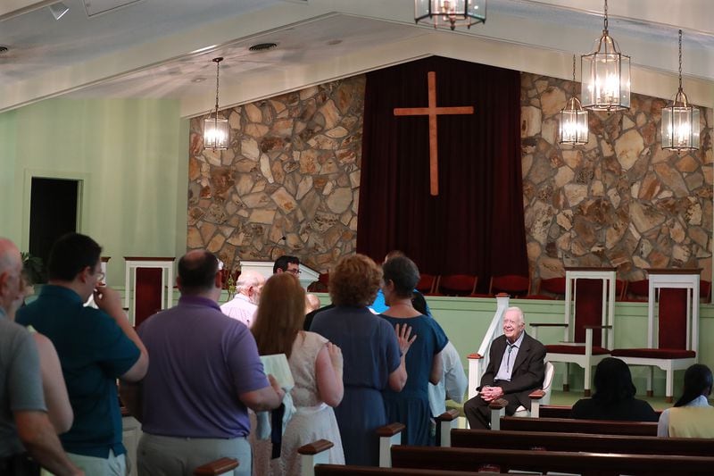 Visitors and members of the congregation line up to have their picture taken with Jimmy Carter after Sunday school and worship service at Maranatha Baptist Church in Plains on Sunday, June 9, 2019, in Plains. Curtis Compton/ccompton@ajc.com