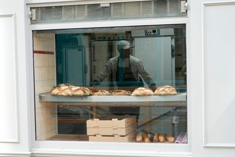 Baker Xavier Netry works at the Utopie bakery Friday, April 26, 2024 in Paris. Baker Xavier Netry was chosen this week as the 31st winner of Paris' annual "Grand Prix de la baguette" prize. The Utopie bakery in Paris' 11th district that Netry works for wins 4,000 euros ($4,290) and becomes one of the suppliers of the presidential Elysee Palace for a year. (AP Photo/Thibault Camus)