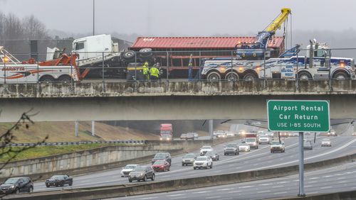 All southbound lanes of the Downtown Connector were shut down for hours Monday after a tractor-trailer wrecked on a bridge and dislodged the chain-link fencing.