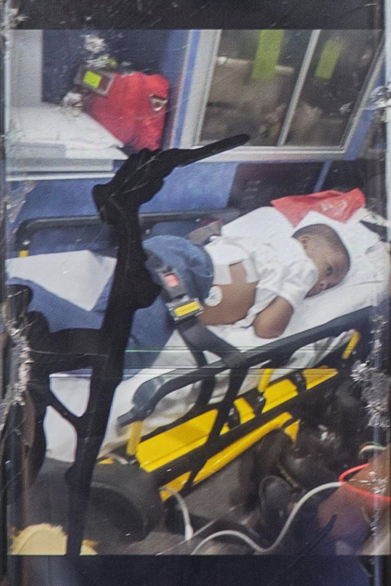 Kevin Johnson took this photo of his son, Kai Johnson, while riding in the back of an ambulance from Wybrooke Elementary School in Stone Mountain, Thursday, April 25, 2019. Kai was shot by a BB or pellet gun while playing outside. Kevin says the gun pierced his son but was stopped by his rib cage. Kevin says he received a phone call from the school saying that his son may have been hit with a rock. Upon entering the school he was told that it was a BB gun pellet and that his son was headed to the emergency room. (ALYSSA POINTER/ALYSSA.POINTER@AJC.COM)