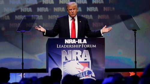 Then-candidate Donald Trump speaks at the National Rifle Association Leadership Forum last year in Louisville, Ky. He will be coming to Atlanta this month to become the first president since Ronald Reagan to speak at the annual NRA conference. (Mark Cornelison/Lexington Herald-Leader/TNS)