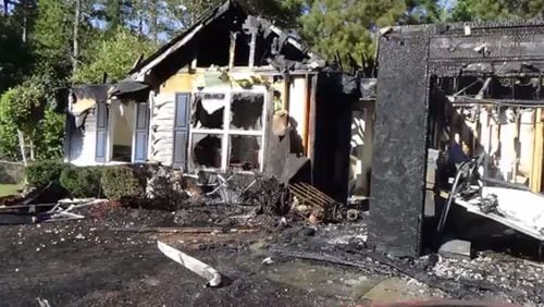 A man, woman and infant escaped a Thursday afternoon fire that destroyed their home on Shelby Lane near Buford. (Credit: Gwinnett County fire)