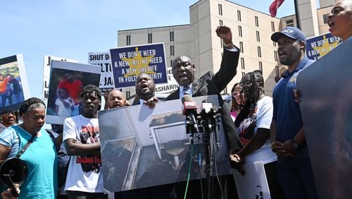 Ben Crump, attorney for Lashawn Thompson’s family, holds up his hand and chants as he speaks to supporters and members of the press outside the Fulton County Jail, Thursday, April 20, 2023, in Atlanta. Lashawn Thompson, 35, was discovered unresponsive in the jail’s psychiatric wing covered in bed bugs in September, according to a Fulton County Medical Examiner report. His body showed no obvious signs of trauma and the cause of death was undetermined, the report said, noting a “severe bed bug infestation” in the jail. (Hyosub Shin / Hyosub.Shin@ajc.com)