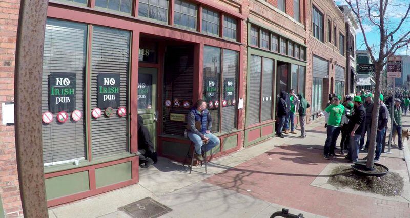 Bill Johns acted as a bouncer Sunday, March 10 2018 outside the "No Irish Pub,” a fake pub set up for one day on Michigan Avenue in Detroit as part of an experiment to raise awareness about how poorly Irish immigrants were once treated in the U.S., and to make people think about how immigrants are treated today.