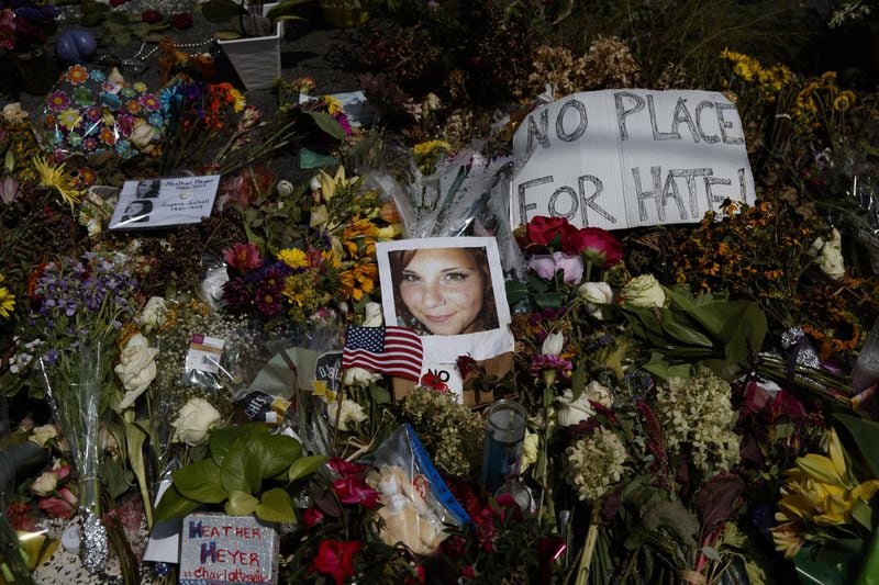 A photo of Heather Heyer, who was killed during a white nationalist rally, sits on the ground at a memorial the day her life was celebrated at the Paramount Theater on Wednesday in Charlottesville, Va. AP PHOTO / EVAN VUCCI
