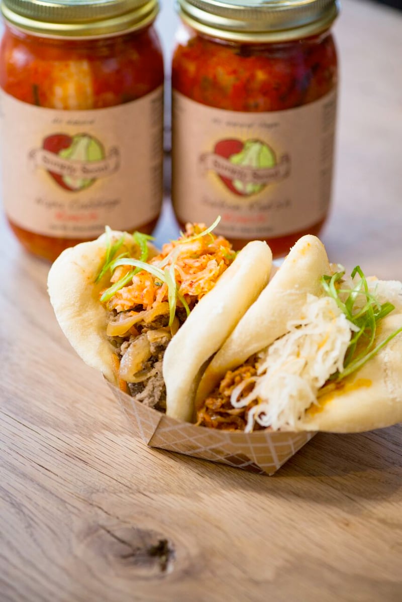  Simply Seoul began offering buns as a way to offer farmers market customers a quick bite. Now they're the staple of Simply Seoul Kitchen in Ponce City Market and a popular item for catering clients. Pictured here are pork buns and beef buns. Photo credit: Mia Yakel.