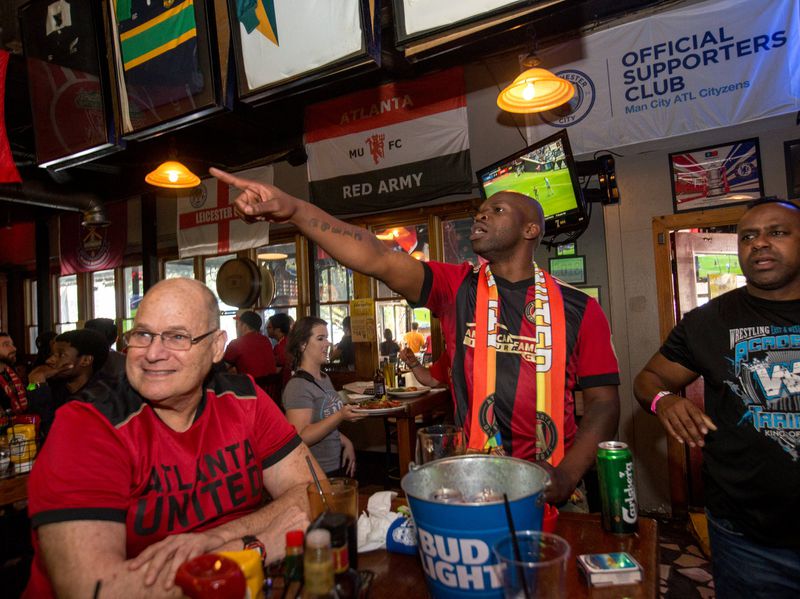 Atlanta United fans, including (from left) Jim Herald, James D. Dixon III and Tony Broughton, gather at Brewhouse in Little Five Points. (Jenni Girtman / Atlanta Event Photography)