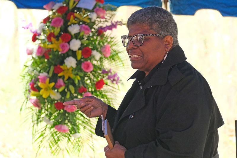 Carolyn L. Mazloomi, founder of Women of Color Quilters Network, speaks to a crowd gathered to celebrate the recommittal and dedication of a new headstone for Harriet and Armstead Powers Saturday December 2, 2023 at the Gospel Pilgrim Cemetery in Athens, GA. Powers was an emancipated slave whose quilts can be seen at the Smithsonian Museum and the Museum of Fine Arts in Boston. 

credit: Nell Carroll for the AJC