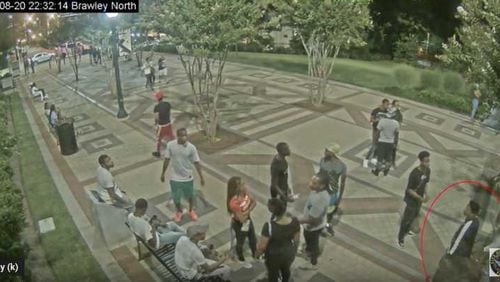 Atlanta police released video of a man wanted in connection with the Aug. 20 shooting of four college students, two from Clark Atlanta University and two from Spelman College. The suspect is circled in red. ATLANTA POLICE DEPARTMENT.