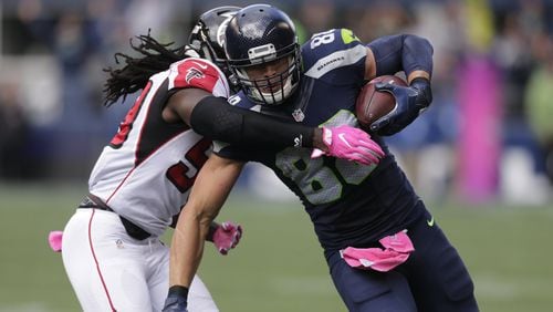 Seahawks tight end Jimmy Graham is tackled by Falcons outside linebacker De’Vondre Campbell on Sunday, Oct. 16, 2016, in Seattle. (AP Photo/Stephen Brashear)