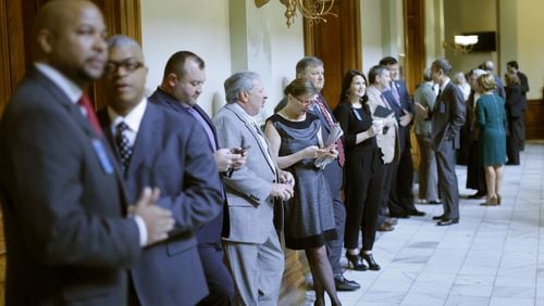 Registered lobbyists line the halls during the 2016 legislative session. Lobbyists in Georgia are required to register with the state ethics commission but some think many avoid doing so. BOB ANDRES / BANDRES@AJC.COM