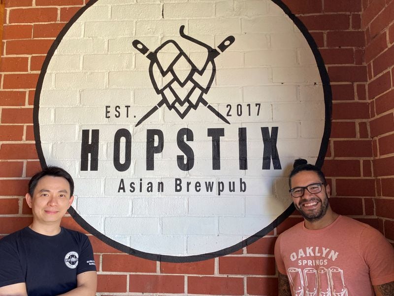 Andy Tan (left) and Justin Ramirez collaborated on the design for the new Hopstix logo.
Bob Townsend for The Atlanta Journal-Constitution
