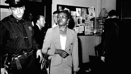 Izola Ware Curry enters a New York City police station, Sept. 20, 1958, where she was questioned in the stabbing of the Rev. Dr. Martin Luther King Jr. in a department store in Harlem during a book signing. Police said the civil rights leader was stabbed by Mrs. Curry, who told them several "rambling" stories and at times was incoherent. (AP Photo/Marty Lederhandler)