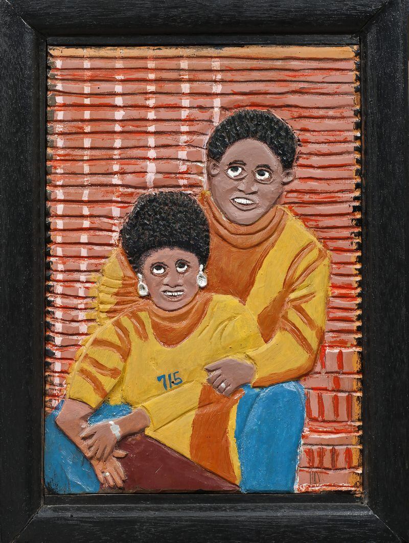In 1974, Elijah Pierce, a self-taught artist from Mississippi, created this painted, carved portrait of Henry Aaron and his wife Billye Aaron, to commemorate Aaron’s 715th home run. Photo: courtesy High Museum