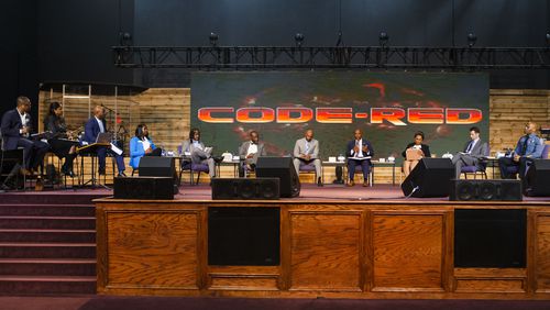 A panel of Gwinnett County school system administrators, elected officials and community leaders starts a "Code Red" meeting for the community, on Wednesday, Nov. 2, 2022, at New Mercies Church in Lilburn. Gwinnett County Public Schools has seen a streak of violence and safety issues, so district and community leaders met for a panel discussion of potential solutions. (Christina Matacotta for The Atlanta Journal-Constitution)