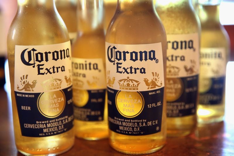 CHICAGO, IL - JUNE 07: In this photo illustration, bottles of Corona beer are shown on June 7, 2013 in Chicago, Illinois. Constellation Brands, one of the world's largest wine companies, is expected to become the third-largest beer supplier in the United State today with a $5.3 billion purchase of the U.S. distribution rights of Grupo Modelo beers from Anheuser Busch InBev. Corona Extra, brewed by Grupo Modelo, is the number one selling imported beer sold in the United States and the number six selling beer overall. (Photo Illustration by Scott Olson/Getty Images)