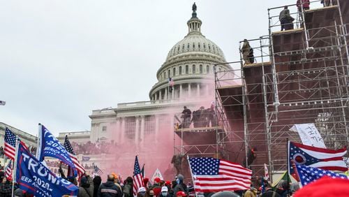 Supporters of President Donald Trump storm the U.S. Capitol in Washington on Wednesday. On Thursday, members of Georgia's U.S. House delegation condemned the rioters but split by party over whether Trump should be held accountable for the violence. (Kenny Holston/The New York Times)