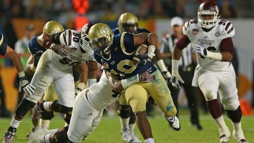 MIAMI GARDENS, FL - DECEMBER 31: Synjyn Days #10 of the Georgia Tech Yellow Jackets carries during the Capital One Orange Bowl game against the Mississippi State Bulldogs at Sun Life Stadium on December 31, 2014 in Miami Gardens, Florida. (Photo by Mike Ehrmann/Getty Images) Former Georgia Tech running back Synjyn Days' powerful running style earned him an invitation into the Medal of Honor Bowl. He is making good use of the opportunity, attracting the attention of NFL scouts. (ASSOCIATED PRESS)