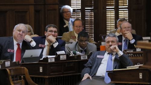 State lawmakers, including Rep. Earl Ehrhart, R-Powder Springs, front right, watch the vote on Feb. 22, 2017, on Ehrhart's bill to ban state funding from colleges that declare themselves "sanctuary campuses." BOB ANDRES / BANDRES@AJC.COM