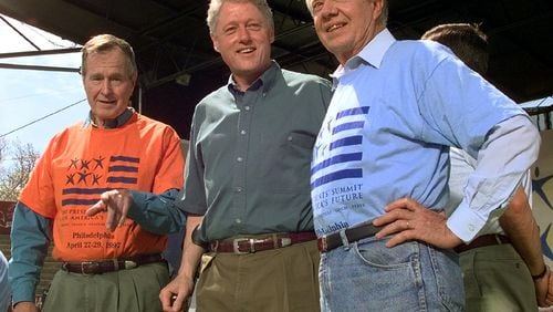 In this 1997 photo from a volunteer summit in Philadelphia, then President Bill Clinton is flanked by former Presidents George H.W. Bush( left) and Jimmy Carter (right, (AP Photo/Greg Gibson)