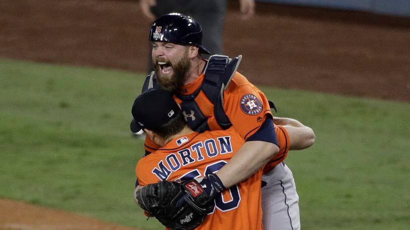 Houston Astros catcher Brian McCann and pitcher Charlie Morton celebrate after win against the Los Angeles Dodgers in Game 7 of baseball's World Series Wednesday, Nov. 1, 2017, in Los Angeles. The Astros won 5-1 to win the series 4-3. (AP Photo/Jae C. Hong)