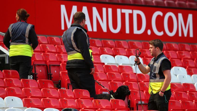 MANCHESTER, ENGLAND - MAY 15: A sniffer dog patrols the stands as the match is abandoned with fans evacuated from the ground prior to the Barclays Premier League match between Manchester United and AFC Bournemouth at Old Trafford on May 15, 2016 in Manchester, England. (Photo by Alex Livesey/Getty Images)