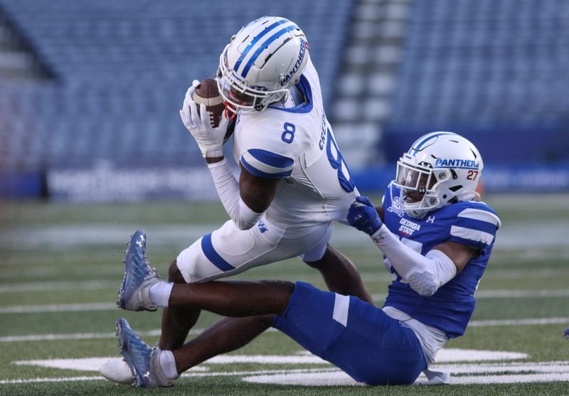 Georgia State Panthers wide receiver Ja'Cyais Credle (8) is taken down by Georgia State Panthers cornerback Jaylon Jones (27) during the Georgia State Panthers 2022 spring game on Friday, April, 2022, in Atlanta. Branden Camp/For The Atlanta Journal-Constitution