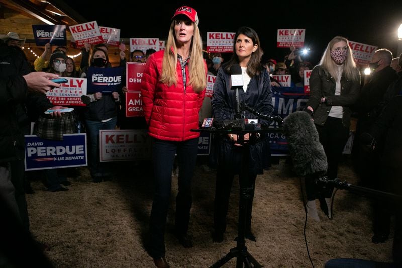 Georgia Republican U.S. Sen. Kelly Loeffler, left, and former U.N. Ambassador Nikki Haley take questions from the media during a rally on Dec. 20, 2020, in Cumming. (Jessica McGowan/Getty Images/TNS) 