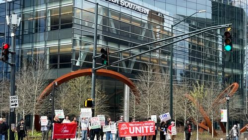 A few dozen protesters rallied in front of Norfolk Southern's headquarters in Midtown Atlanta on Saturday, March 11, 2023, voicing support for rail workers and residents affected by the East Palestine derailment.
