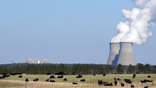 Cattle graze near the cooling towers for Georgia Power’s Vogtle nuclear power plant in Waynesboro, near Augusta. The utility is adding two new reactors, doubling the number at the plant. (Erik Lesser/Zuma Press/TNS)