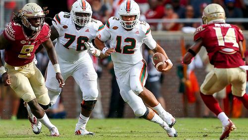 TALLAHASSEE, FL -  OCTOBER 7:  Quarterback Malik Rosier #12 of the Miami Hurricanes scrambles for yardage against the Florida State Seminoles during the first half of an NCAA football game at Doak S. Campbell Stadium on October 7, 2017 in Tallahassee, Florida. (Photo by Butch Dill/Getty Images)