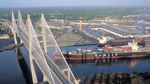 A cargo ship on the Savannah River passes under the Eugene Talmadge Memorial Bridge on its way to the Port of Savannah. AJC file