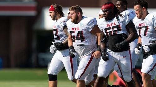Falcons offensive lineman Ryan Neuzil (64) during training camp at the Falcons Training Facility in Flowery Branch, Ga., on Tuesday, August 15, 2023. Also pictured: offensive linemen Tyler Vrabel (73), Jonotthan Harrison (62) and Jalen Mayfield (77). (Photo by Jay Bendlin/Atlanta Falcons)